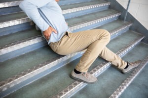 a-man-slipping-down-the-stairs-and-sustaining-injuries