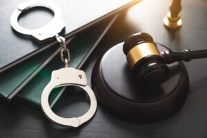 handcuffs-beside-gavel-and-law-books