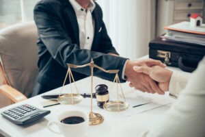 A Business Lawyer Shaking Hands With A Client