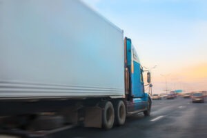 a-semi-truck-driving-in-a-city-like-detroit