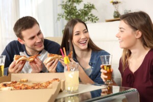 three friends drinking at a party