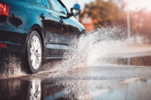 car driving through a puddle