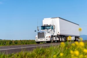moving-truck-driving-down-the-road