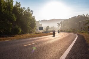 people riding away on motorcycles
