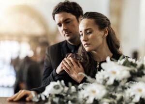 sad couple grieving over wrongful death victim