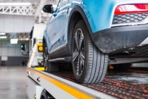car on tow truck after truck crash