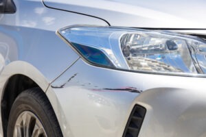 silver car with damage after an accident